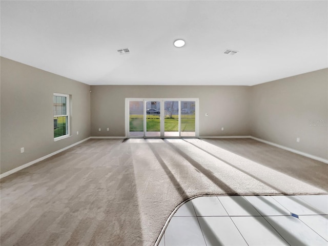 unfurnished room with light carpet