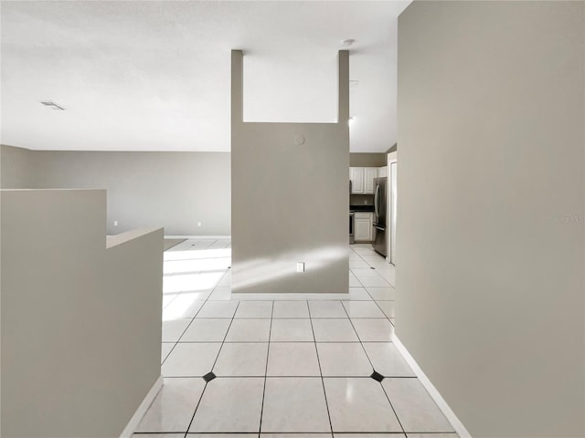 hallway with light tile patterned floors