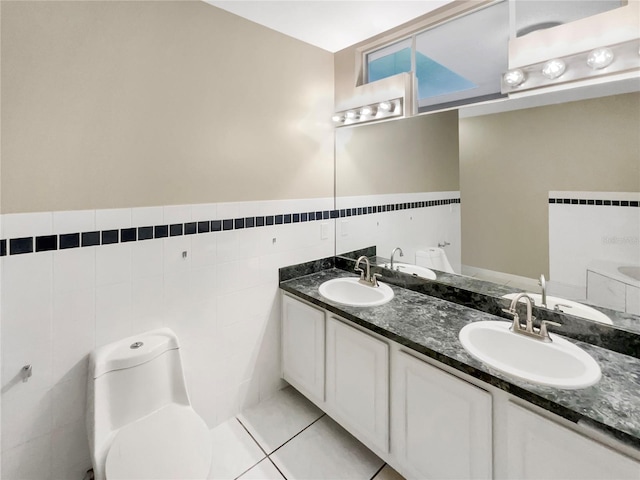 bathroom featuring tile walls, tile patterned floors, vanity, and toilet