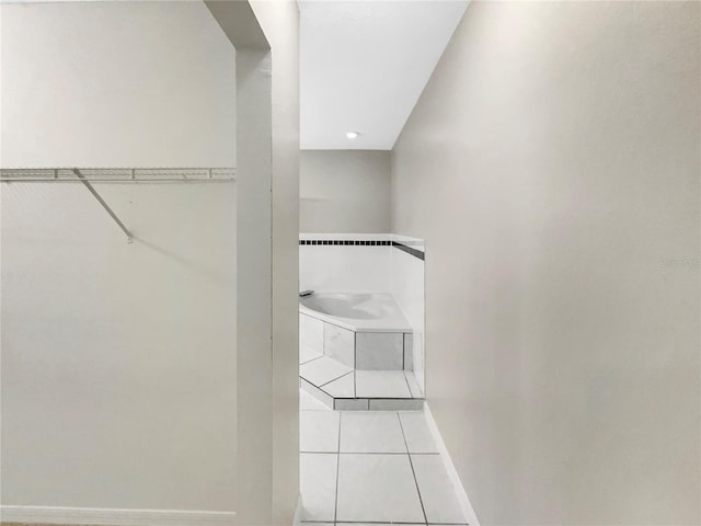 spacious closet featuring light tile patterned flooring