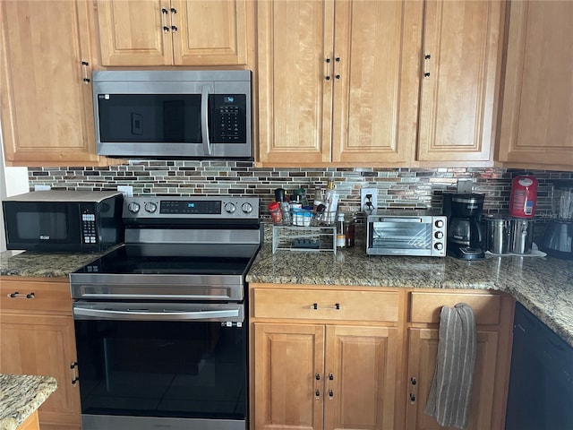 kitchen with black appliances, stone countertops, and backsplash