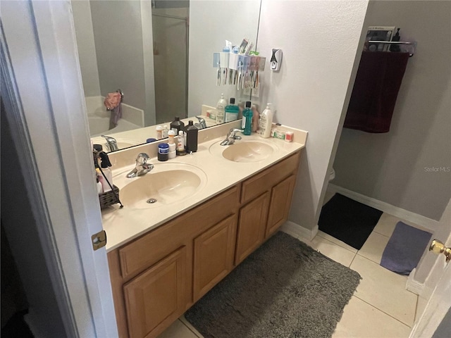 bathroom with vanity, tile patterned floors, and separate shower and tub