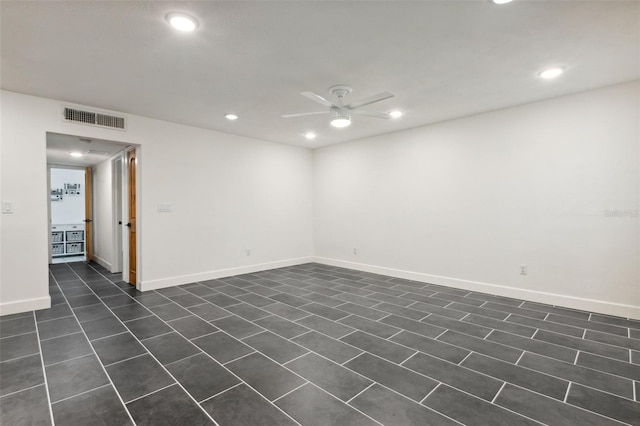 tiled empty room with ceiling fan