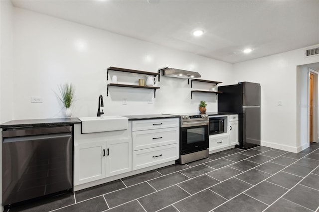 kitchen featuring white cabinetry, black appliances, sink, and exhaust hood