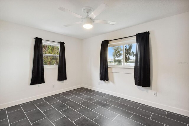 empty room featuring ceiling fan