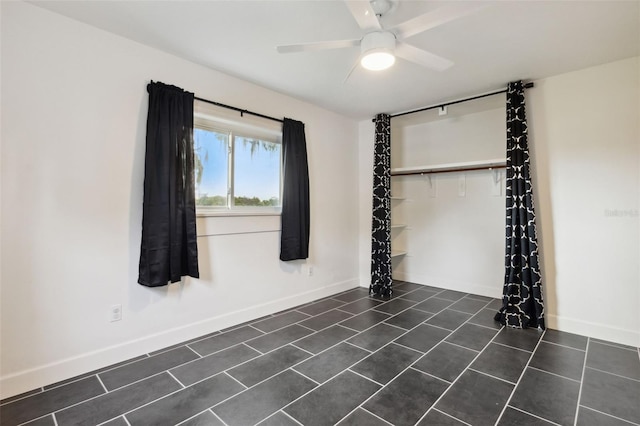 unfurnished room with ceiling fan