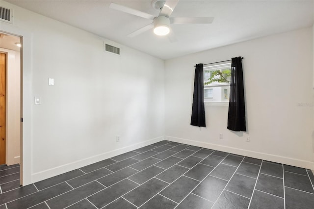 spare room with ceiling fan