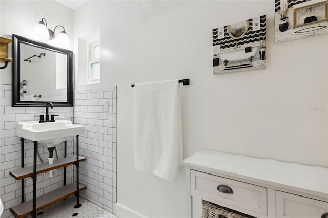 bathroom featuring tile walls, sink, and tile patterned flooring