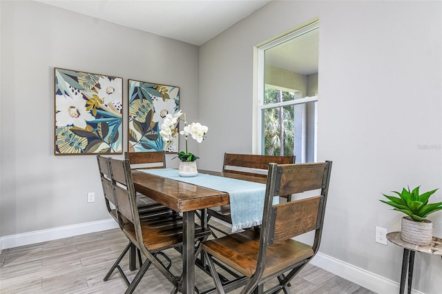 dining room with light wood-type flooring