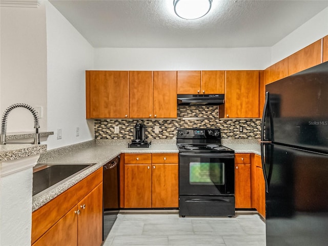 kitchen featuring a textured ceiling, black appliances, sink, and backsplash