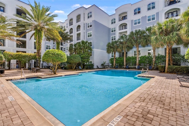 view of swimming pool featuring a patio