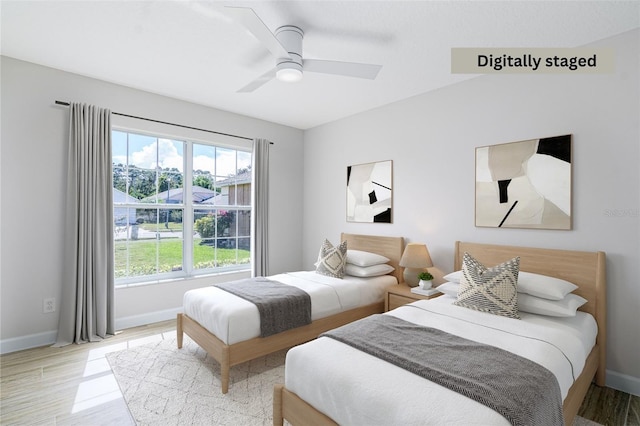 bedroom featuring light wood-type flooring and ceiling fan