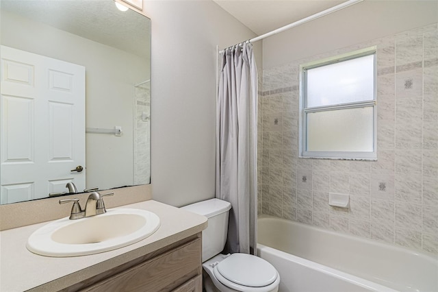 full bathroom featuring vanity, shower / tub combo with curtain, and toilet