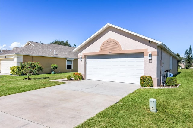 ranch-style house featuring a garage and a front lawn