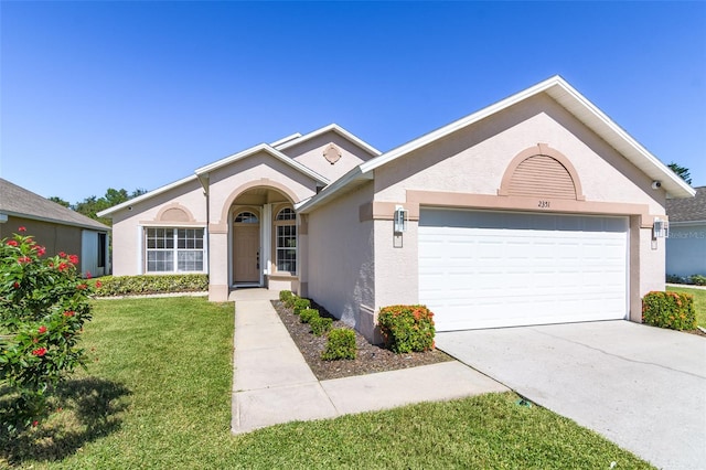 ranch-style home featuring a front yard and a garage