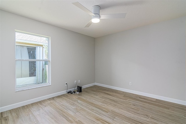 spare room with ceiling fan and light hardwood / wood-style flooring