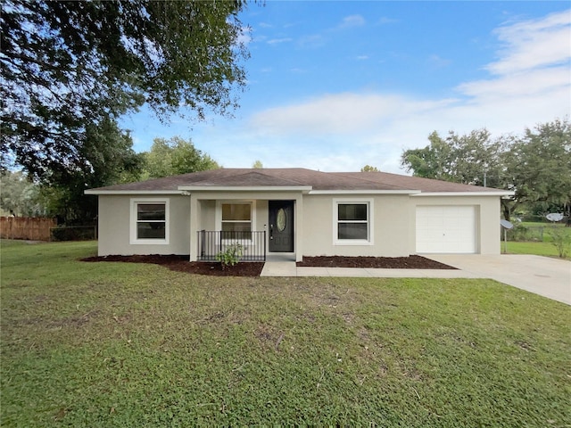 single story home with covered porch, a front yard, and a garage