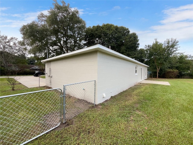 view of property exterior with a lawn