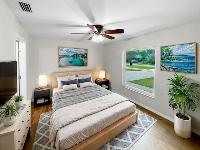 bedroom featuring light wood-type flooring and ceiling fan