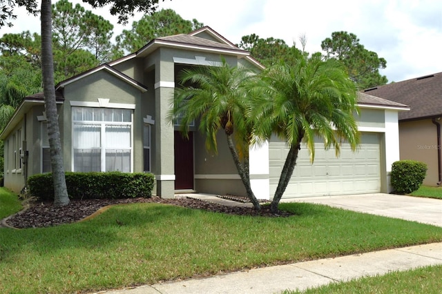 view of front of property featuring a front yard and a garage