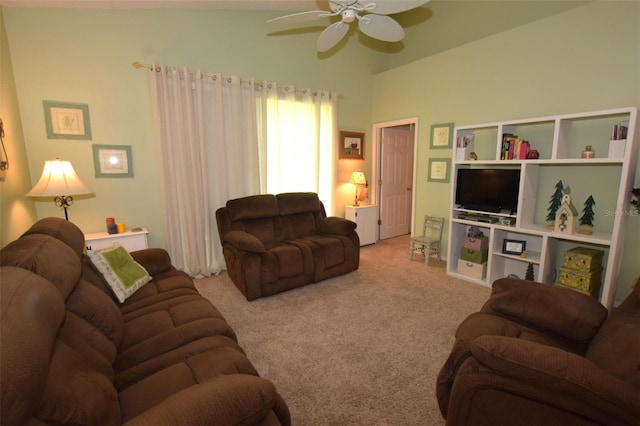 carpeted living room with ceiling fan