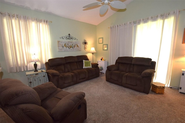 living room with lofted ceiling, carpet floors, and ceiling fan