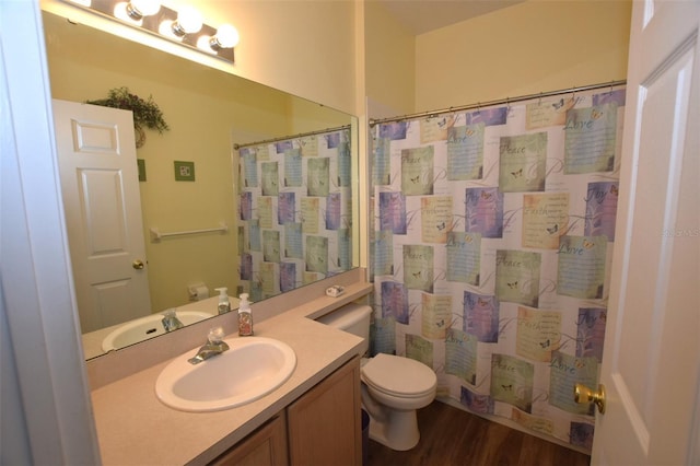 bathroom with vanity, walk in shower, hardwood / wood-style flooring, and toilet