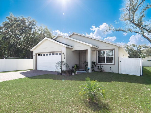 view of front facade with a front yard and a garage