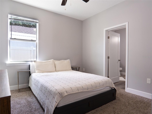 bedroom featuring connected bathroom, carpet, and ceiling fan