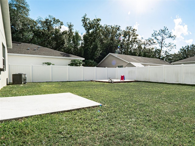 view of yard with a patio area and central AC