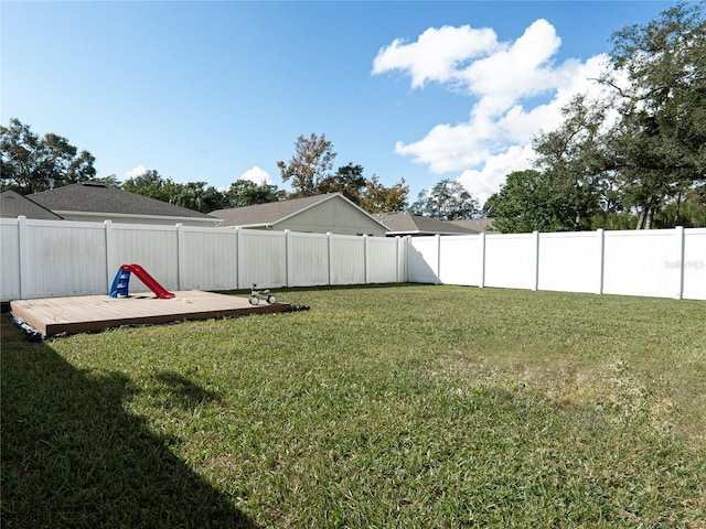 view of yard with a wooden deck