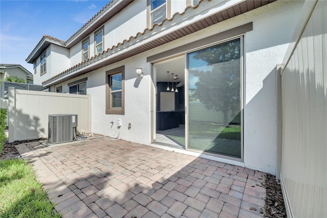 exterior space featuring central AC unit and a patio area