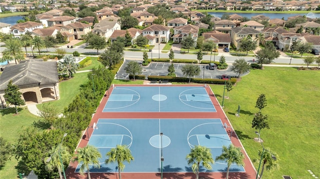 view of basketball court featuring a water view