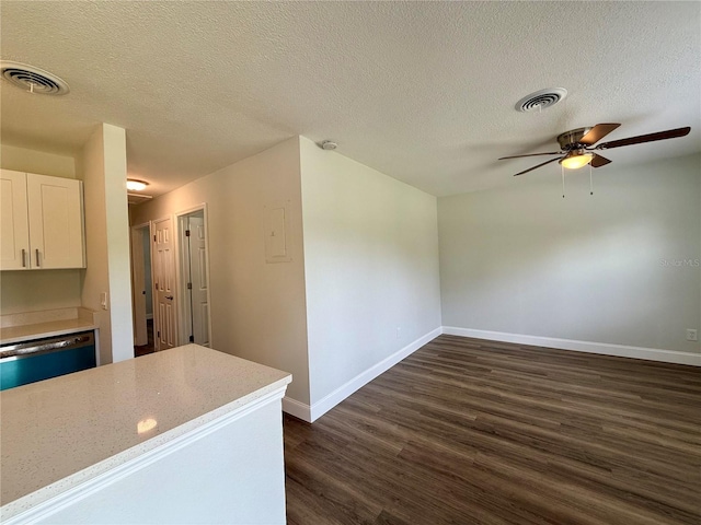 kitchen featuring ceiling fan, dark hardwood / wood-style flooring, a textured ceiling, white cabinetry, and dishwasher