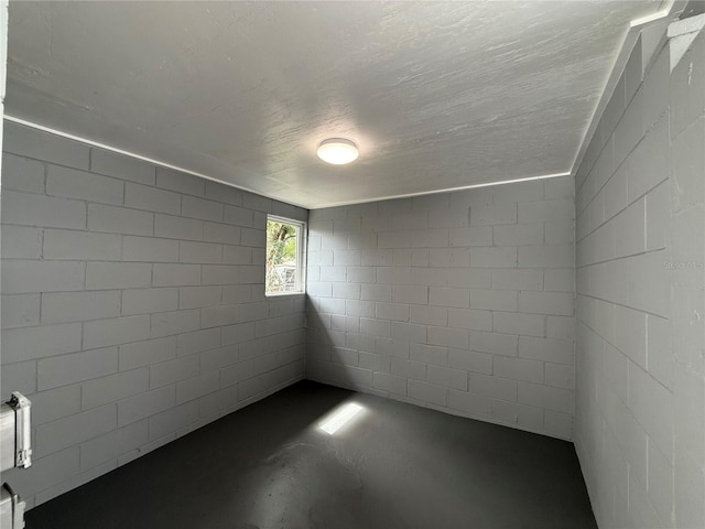 spare room with a textured ceiling