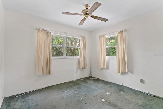 carpeted empty room with ceiling fan