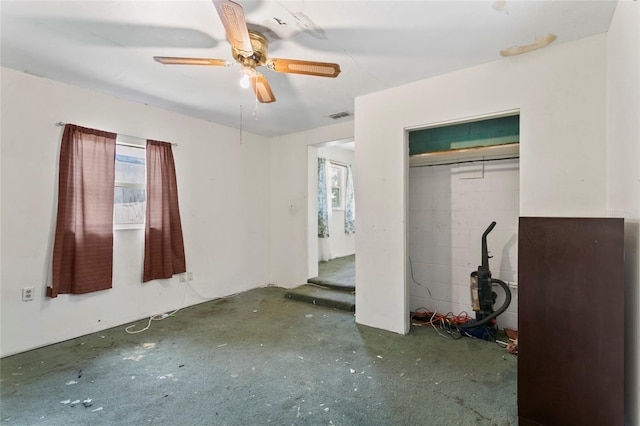 unfurnished bedroom with a closet and ceiling fan