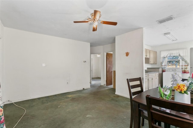 dining space with washer / dryer and ceiling fan