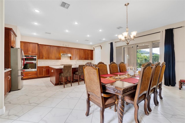 dining space with a notable chandelier