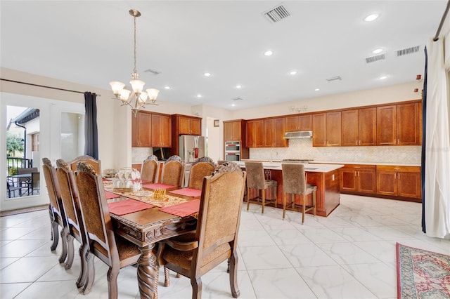 dining area with a notable chandelier