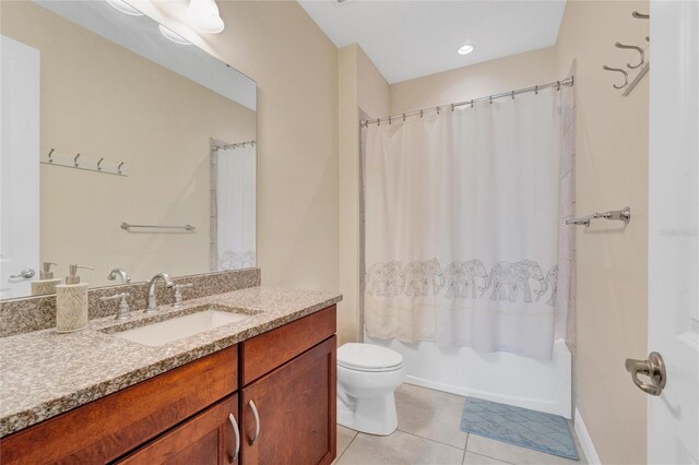 full bathroom featuring toilet, tile patterned floors, shower / tub combo, and vanity