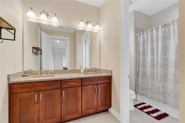 full bathroom with tile patterned floors, vanity, shower / bath combo with shower curtain, and toilet