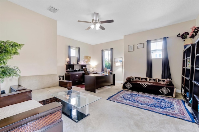 living room with light carpet and ceiling fan