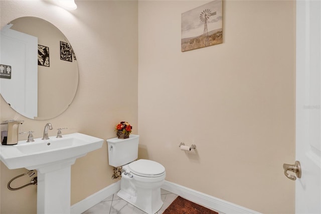 bathroom featuring sink and toilet