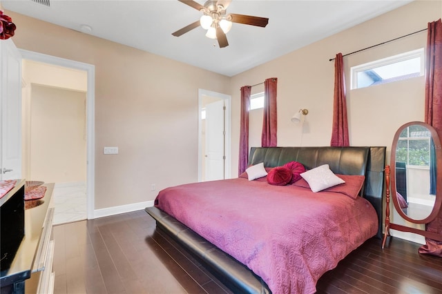 bedroom with ceiling fan and dark wood-type flooring