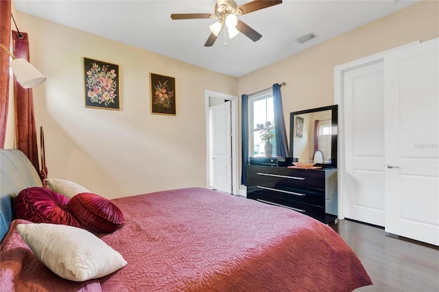 bedroom featuring ceiling fan and dark wood-type flooring