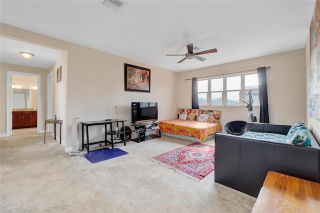 carpeted living room featuring ceiling fan