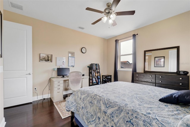 bedroom with ceiling fan and dark hardwood / wood-style flooring