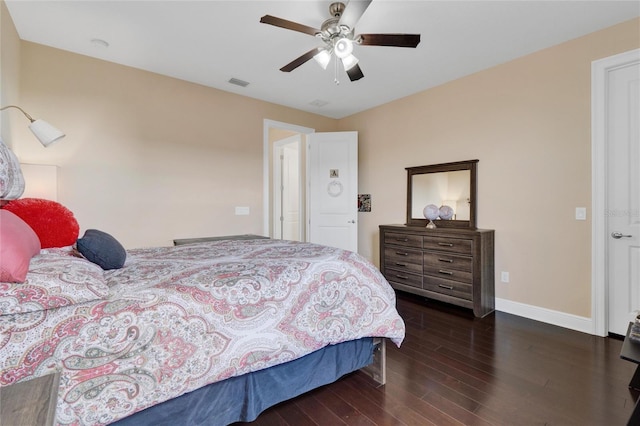 bedroom featuring ceiling fan and dark hardwood / wood-style floors