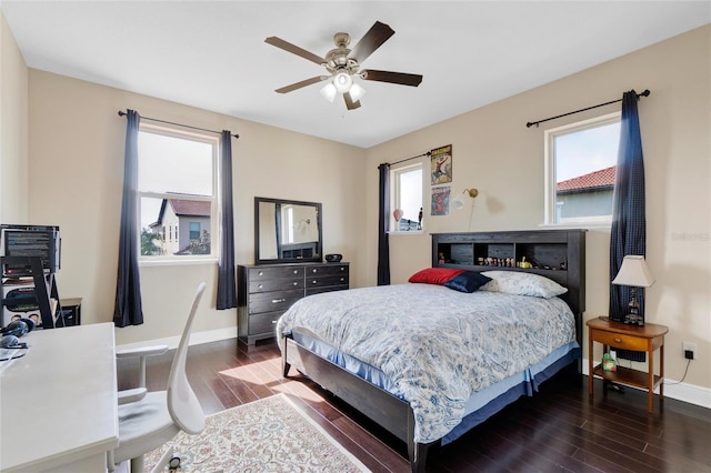 bedroom featuring ceiling fan and dark wood-type flooring